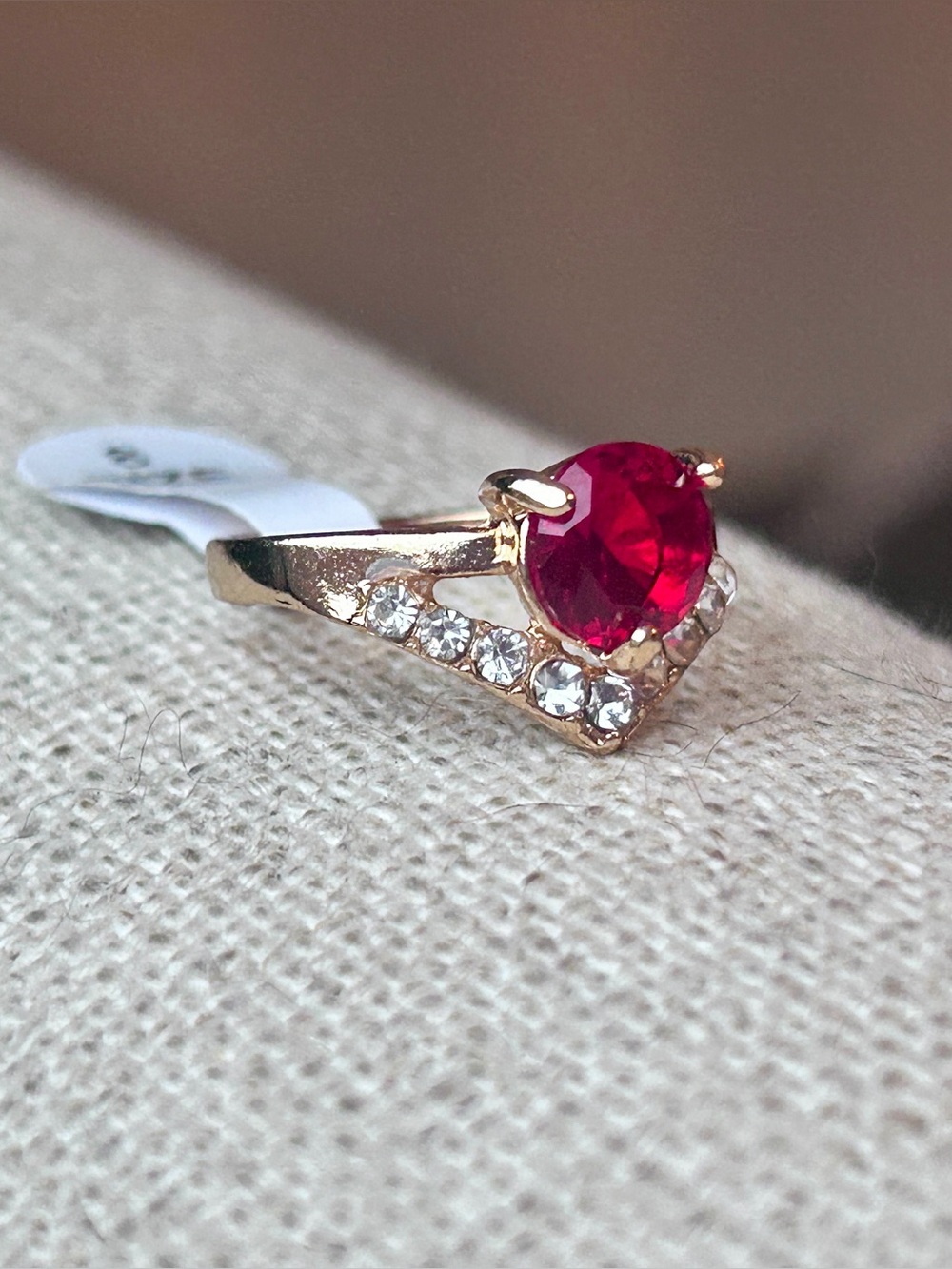 Gold Ring with Red Stone and Clear Accent Stones - size 7